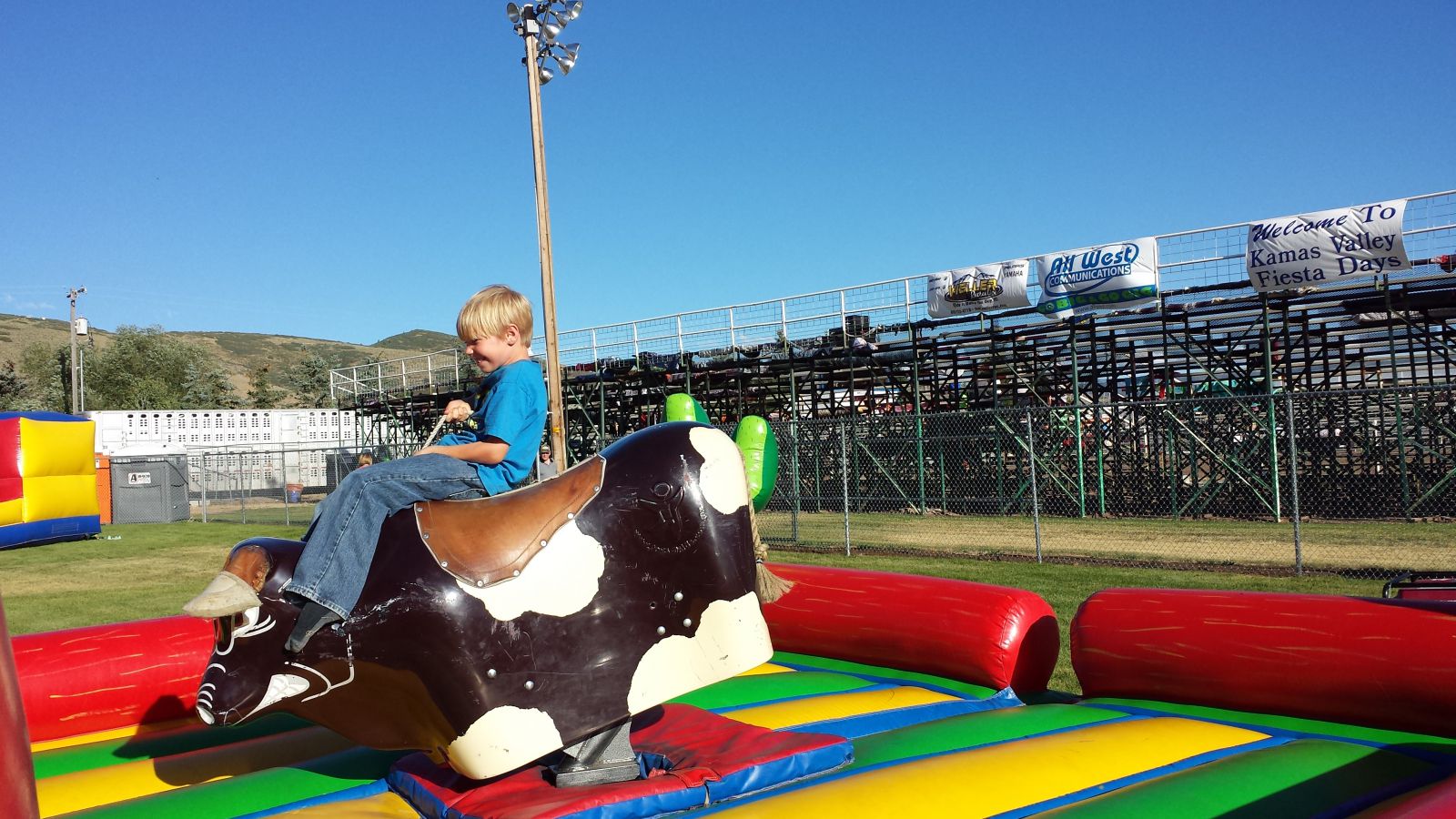 Grandson Reed trying his hand on the bucking bull machine